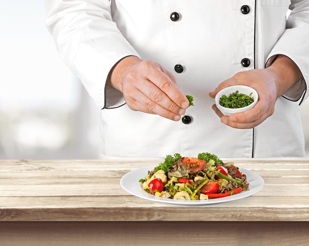 chef preparing a plated dish